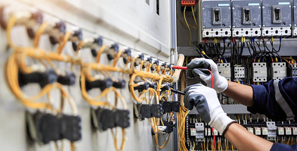 Professional Electrician technician working in Clayton, MO